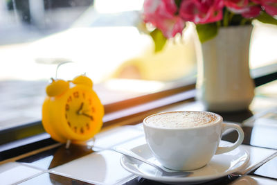 Close-up of coffee cup on table