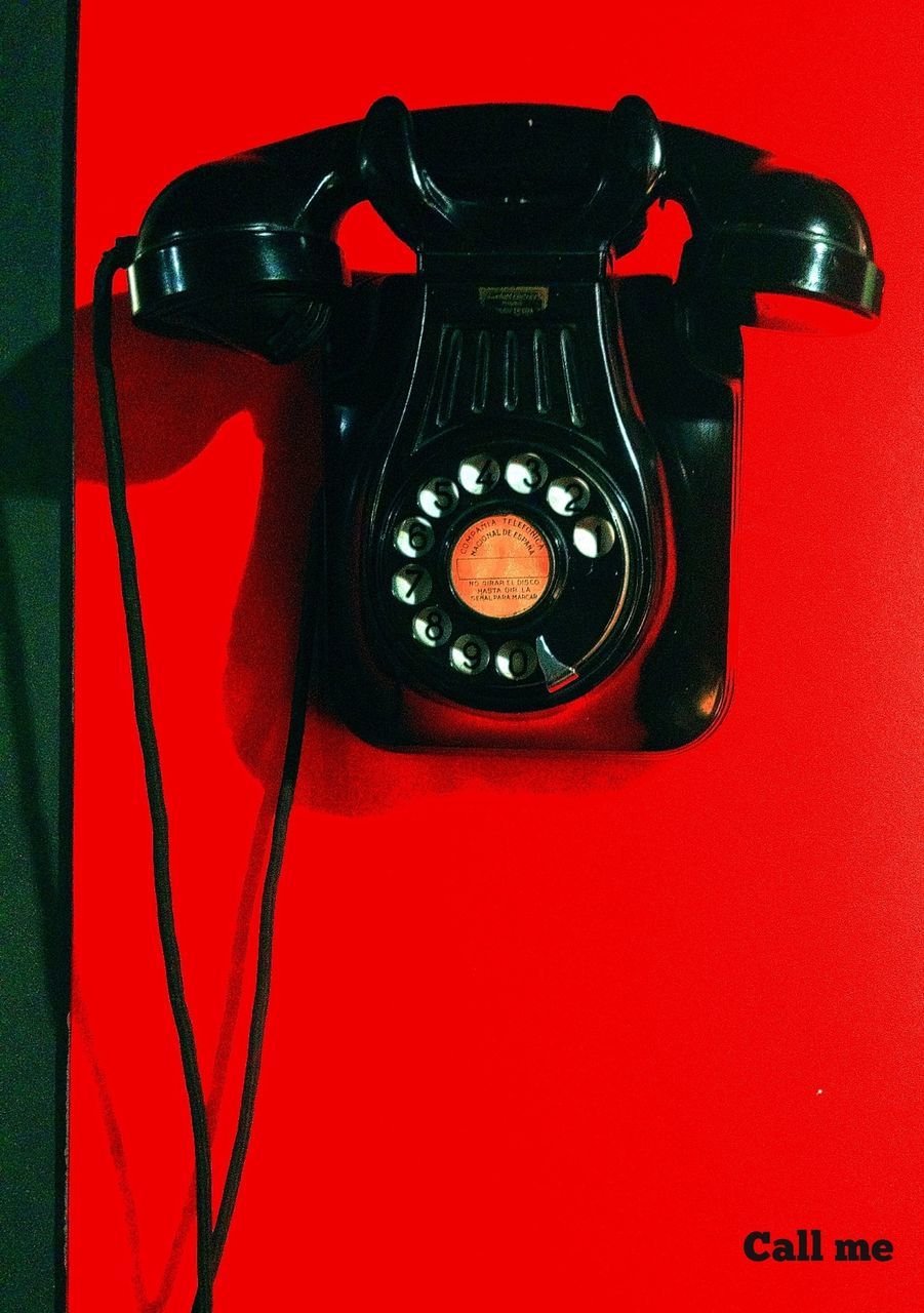 red, indoors, close-up, wall - building feature, single object, technology, old-fashioned, communication, retro styled, still life, studio shot, no people, black color, wall, telephone, part of, connection, time, number, antique