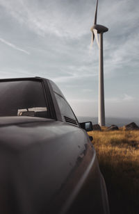 Car on field against sky