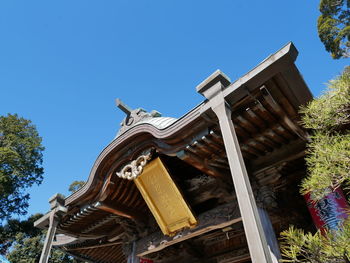 Low angle view of building against clear blue sky