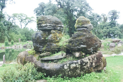 Statue against trees