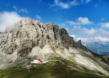 Scenic view of mountains against cloudy sky