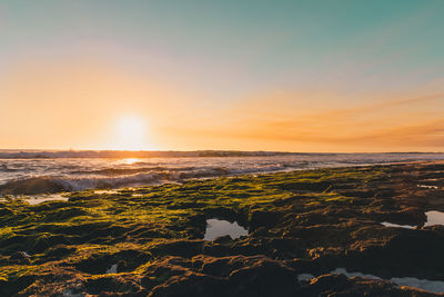 Scenic view of sea against sky during sunset