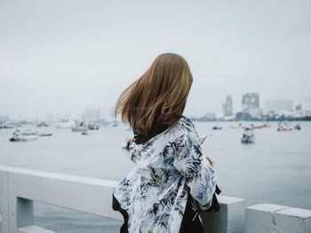 Rear view of woman looking at sea