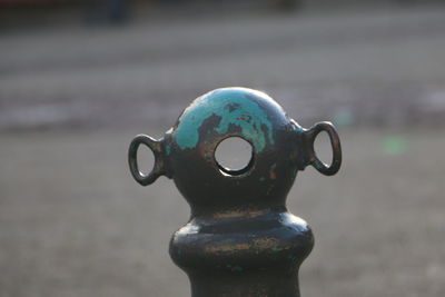 Close-up of metallic object against blurred background