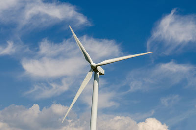 Low angle view of windmill against sky