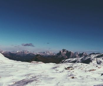 Scenic view of mountains against clear blue sky