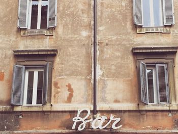 Low angle view of windows on old building