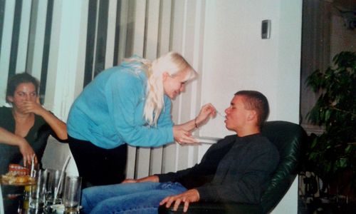 Side view of a couple sitting on table