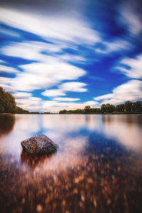 View of lake against cloudy sky