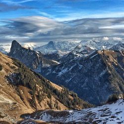 Scenic view of snowcapped mountains against sky