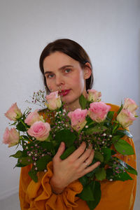 Portrait of woman holding bouquet