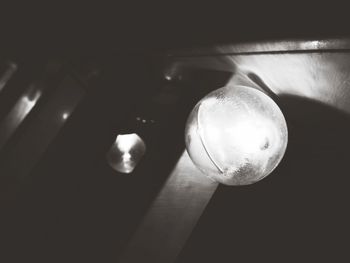 Low angle view of illuminated light bulb