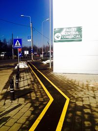 Road sign against clear sky