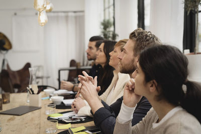 Business people during interview at table in office