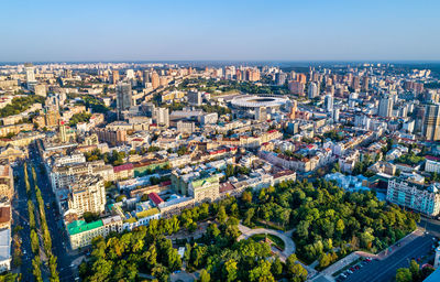 High angle view of modern buildings in city against clear sky