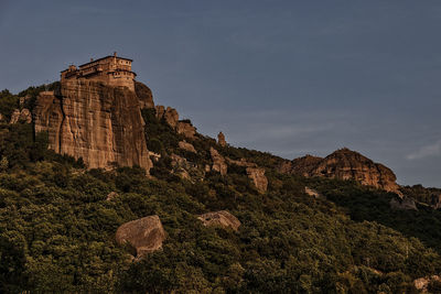 Low angle view of rock formation against sky