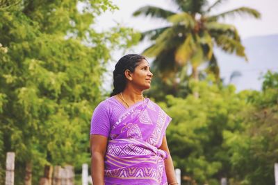 Thoughtful mid adult woman in sari looking away