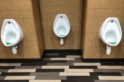 High angle view of urinals in public restroom