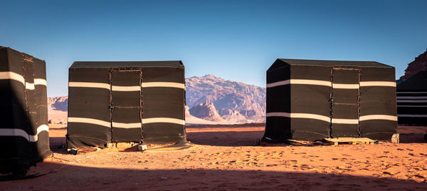 Built structure on beach against clear blue sky