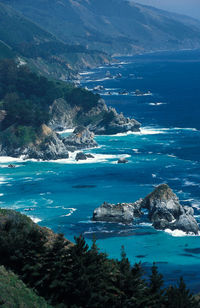 High angle view of sea and rocks against sky