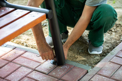 Low section of man walking on footpath