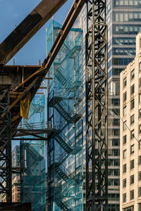 Low angle view of crane at construction site