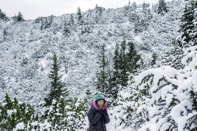 People standing on snow covered mountain