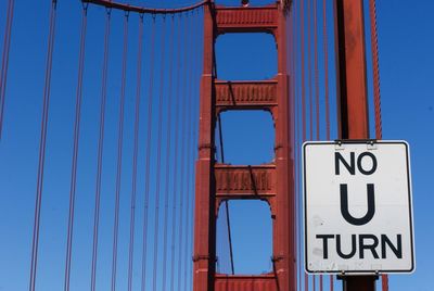 Information sign against blue sky