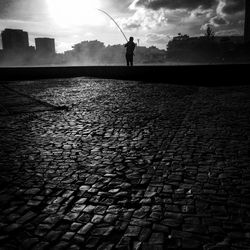 Woman standing against sky