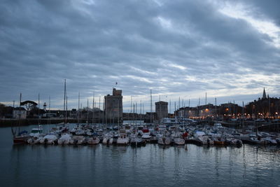 Boats moored at harbor