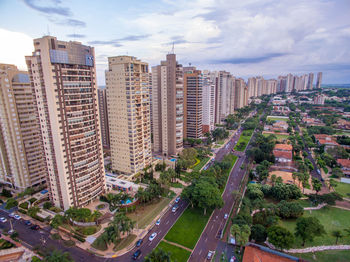 High angle view of buildings in city against sky