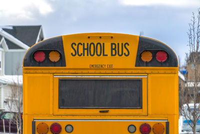 Close-up of yellow information sign