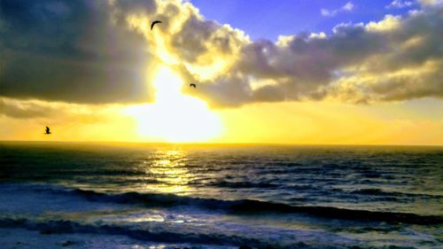 Scenic view of sea against sky during sunset