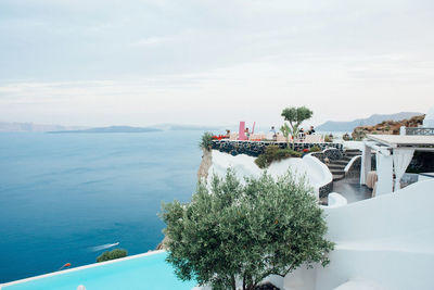 High angle view of swimming pool by sea against sky