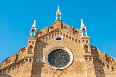 Low angle view of a building against blue sky