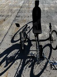 Shadow of bicycle on footpath