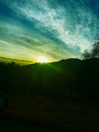 Scenic view of silhouette landscape against sky during sunset