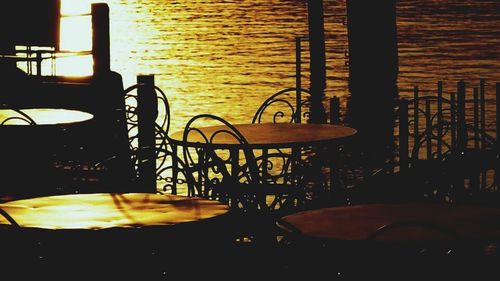 Close-up of empty chairs in the dark