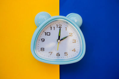 Close-up of clock on wall