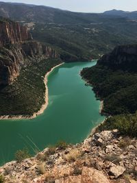 High angle view of river amidst mountains