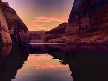 Scenic view of lake against sky during sunset