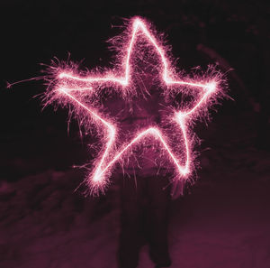 Star shape firework display at night