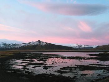 Scenic view of snow covered mountains against sky