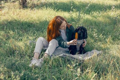 Popsicles pet, summer campaigns more inclusive and fun, red-haired woman, dog in park with ice cream