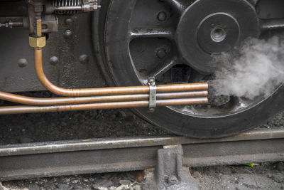 Close-up of steam train on railroad track