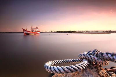 Scenic view of sea against orange sky