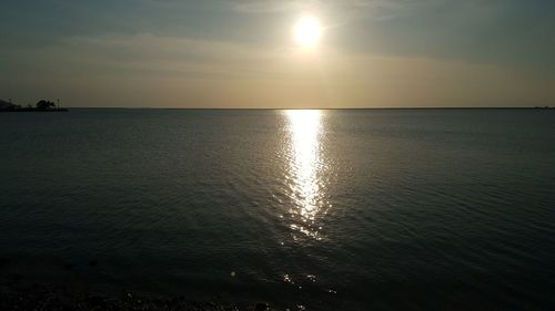 Scenic view of sea against sky at sunset