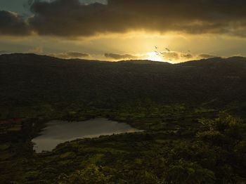 Scenic view of landscape against sky during sunset