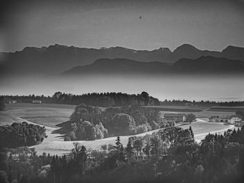 Scenic view of landscape and mountains against sky